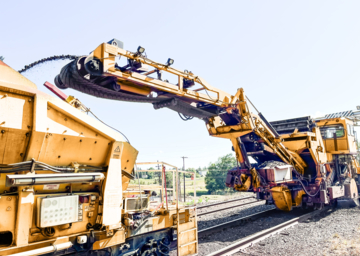 Railroad-Yard-Cleaner-transfering-Iron-Ore-Pellets-from-track-into-RSNA-MHDT Railroad-Yard-Cleaner-transfering-Iron-Ore-Pellets-from-track-into-RSNA-MHDT